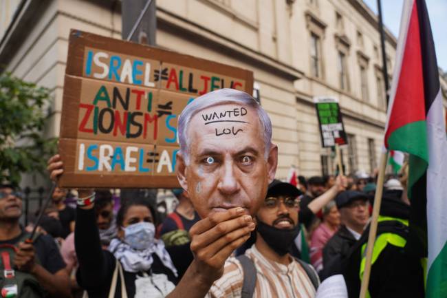 Pro-Palestinian Demo Face-off Pro-Israeli Demonstration Outside UCL A paper mask of Israeli PM Netanyahu, who the International Criminal Court has applied for arrest warrant for, at a pro-Palestine demonstration meeting a pro-Israel demonstration outside the gates of University College London in Gower Street on the 25th of May 2024, London, United Kingdom. Police kept the crowds off the street to let traffic flow and no arrests were made in spite of the provocative taunts by some of the pro-Israel protesters. For weeks UCL students have had a pro-Palestine divestment camp on site like many other universities across the UK. The students want the university to divest from any investments in Israeli companies and to cut all ties with Israeli based universities because of the ongoing onslaught and siege by Israel on Gaza and their occupation of the West Bank in Palestine.(photo by Kristian Buus/In Pictures via Getty Images)