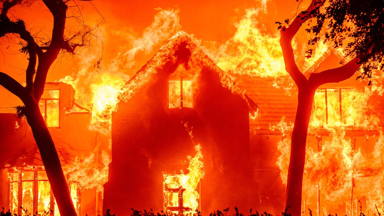 A home is engulfed in flames during the Eaton fire in the Altadena area of Los Angeles County, California on January 8, 2025. (Photo by JOSH EDELSON / AFP)