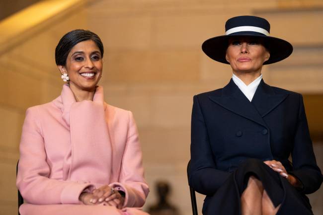US-POLITICS-TRUMP-INAUGURATION (L-R) US Second Lady Usha Vance and First Lady Melania Trump look on as President Donald Trump delivers remarks in Emancipation Hall during inauguration ceremonies at the US Capitol in Washington, DC, on January 20, 2025. (Photo by Greg Nash / POOL / AFP)