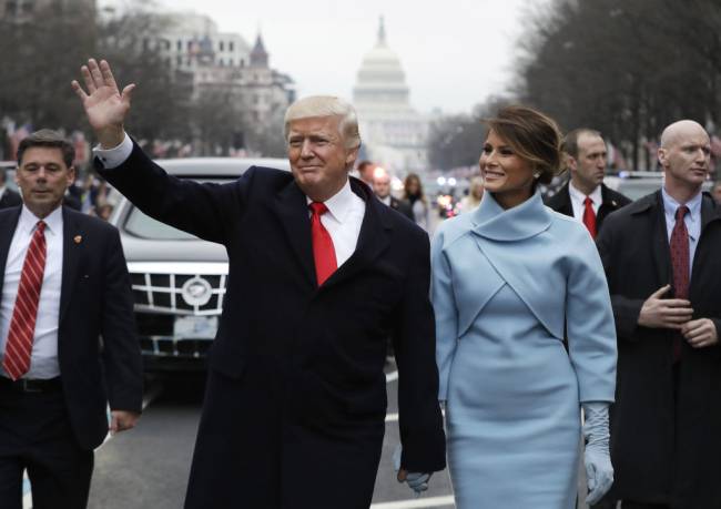 File: President Donald Trump To Miss Bidens Inauguration FILE: U.S. President Donald Trump waves while walking with U.S. First Lady Melania Trump, during a parade following the 58th presidential inauguration in Washington, D.C., U.S., on Friday, Jan. 20, 2017. President Donald Trump says he wont attend President-elect Joe Bidens inauguration next week after Trump supporters mounted a violent assault on the U.S. the capitol. Trumps decision to skip the ceremony is a notable break from recent precedent as we look back on Trumps own inauguration 4 years ago on the 20th Jan, 2017. Photographer: Evan Vucci/Pool via Bloomberg