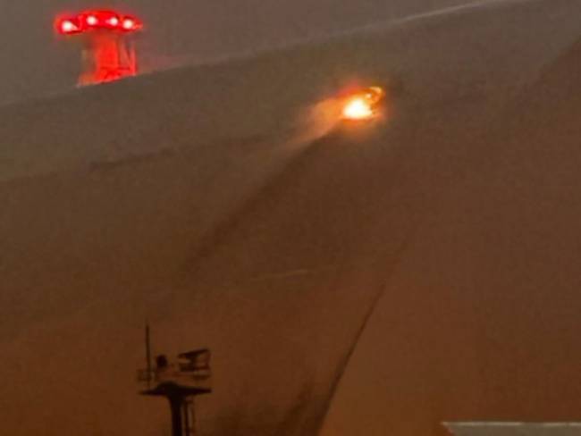 A handout images taken from the X account of the International Atomic Energy Agency (IAEA) on February 14, 2025 shows a glow after an UAV apparently had struck the roof at the New Safe Confinement (NSC), which protects the remains of reactor 4 of the former Chornobyl NPP, causing a fire. Ukrainian's president said on February 14, that a Russian drone had struck overnight a cover built to contain radiation at the Chernobyl nuclear power plant, adding that 