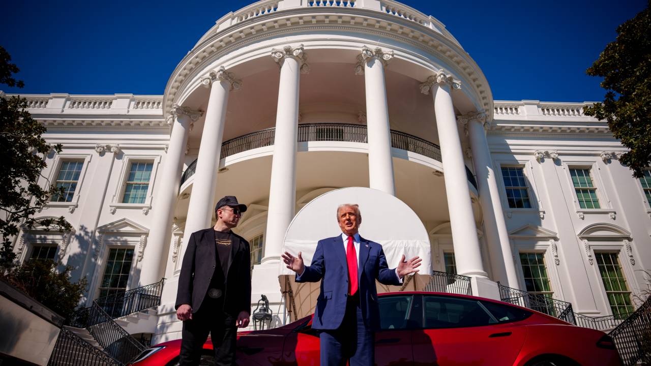 WASHINGTON, DC - MARCH 11: U.S. President Donald Trump, accompanied by White House Senior Advisor, Tesla and SpaceX CEO Elon Musk speaks next to a Tesla Model S on the South Lawn of the White House on March 11, 2025 in Washington, DC. Trump spoke out against calls for a boycott of Elon Musk's companies and said he would purchase a Tesla vehicle in what he calls a 'show of confidence and support' for Elon Musk. Andrew Harnik/Getty Images/AFP (Photo by Andrew Harnik / GETTY IMAGES NORTH AMERICA / Getty Images via AFP)