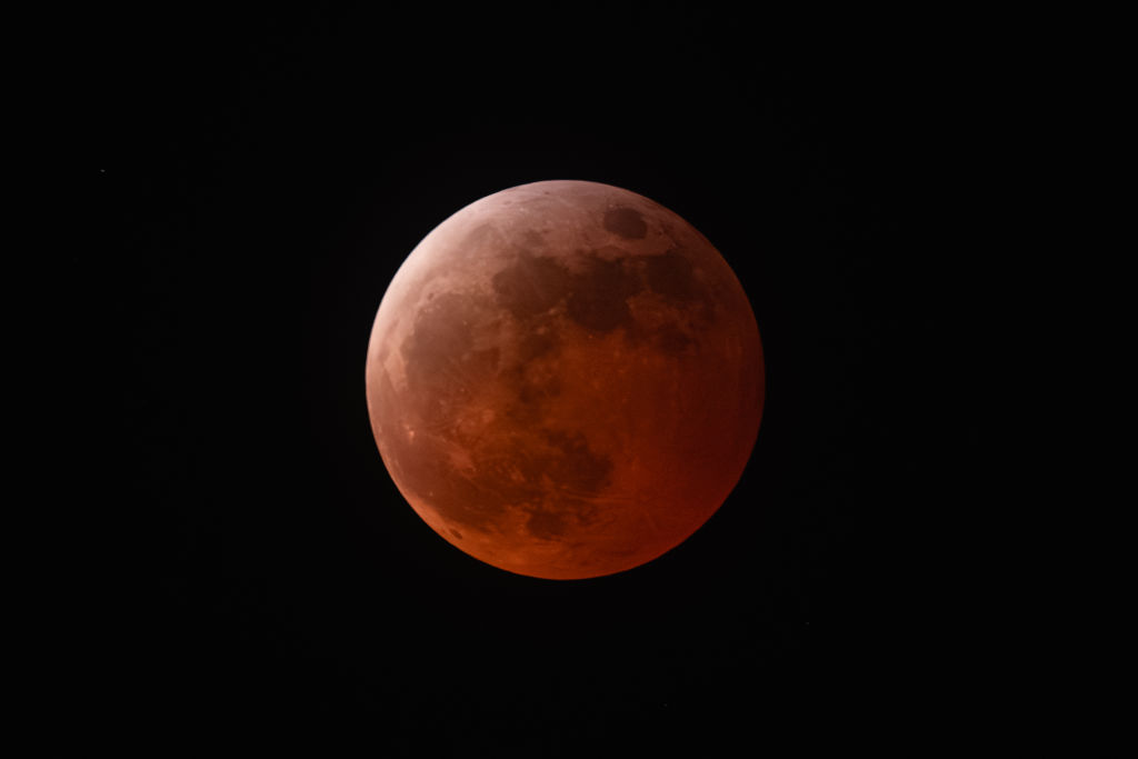 - MARCH 13: The moon is seen during a total lunar eclipse on March 13, 2025 in Los Angeles, California. A total lunar eclipse is visible across the U.S. on the night of March 13, with the moon appearing a deep reddish color as it passes through the Earth's shadow.