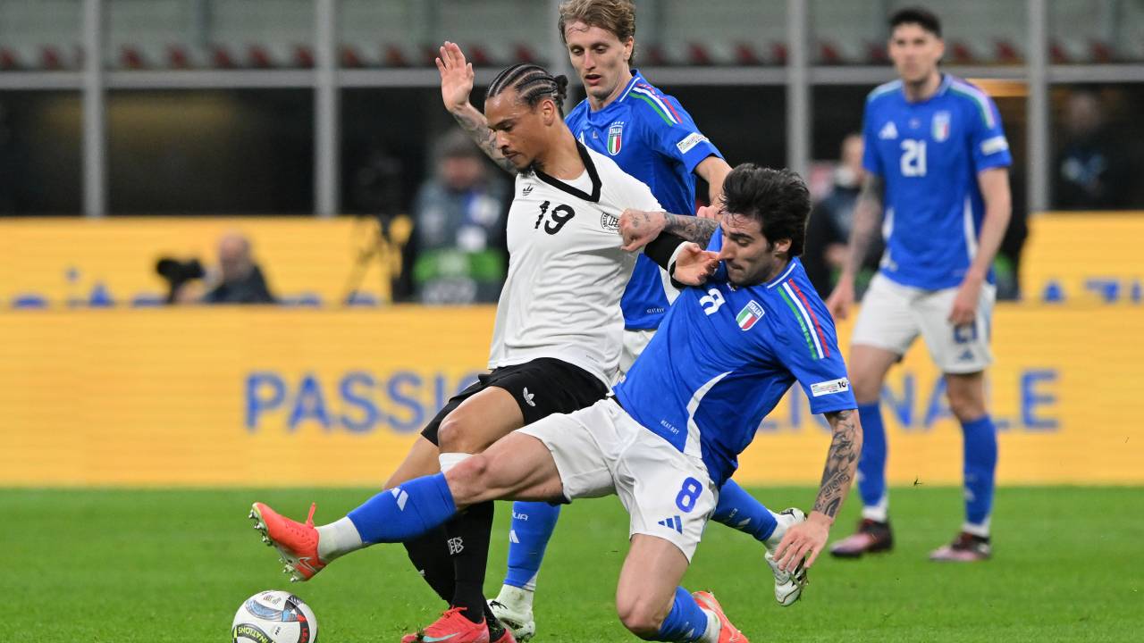 MILAN, ITALY - MARCH 20: Leroy Sané of Germany challenged by Sandro Tonali of Italy during the UEFA Nations League quarterfinal leg one match between Italy and Germany at Stadio San Siro on March 20, 2025 in Milan, Italy. (Photo by Chris Ricco/Getty Images)