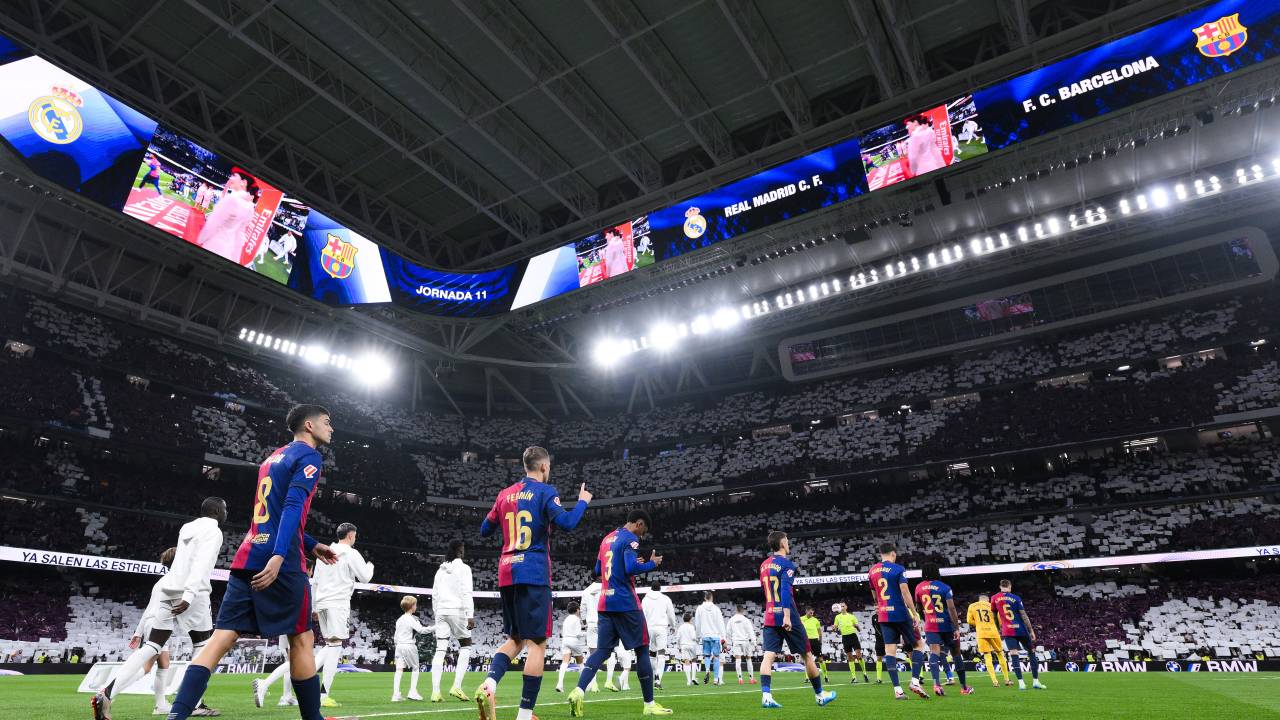 MADRID, SPAIN - OCTOBER 26: FC Barcelona and Real Madrid CF players walk onto the pitch prior the LaLiga match between Real Madrid CF and FC Barcelona at Estadio Santiago Bernabeu on October 26, 2024 in Madrid, Spain. (Photo by David Ramos/Getty Images)