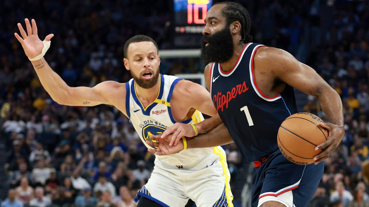 SAN FRANCISCO, CALIFORNIA - APRIL 13: James Harden #1 of the LA Clippers is guarded by Stephen Curry #30 of the Golden State Warriors during the second half at Chase Center on April 13, 2025 in San Francisco, California. NOTE TO USER: User expressly acknowledges and agrees that, by downloading and/or using this photograph, user is consenting to the terms and conditions of the Getty Images License Agreement.