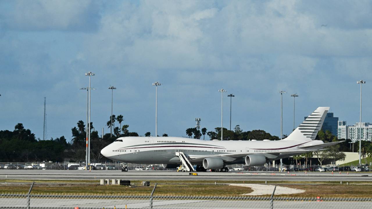 In this February 15, 2025 a Boeing 747 sits on the tarmac of Palm Beach International airport after US President Donald Trump toured the aircraft on February 15, 2025. Donald Trump plans to accept a luxury Boeing jet from the Qatari royal family for use as Air Force One and then continue flying in it after his tenure, despite strict rules on US presidential gifts, media reported May 11, 2025. Calling the plane a "flying palace," ABC News, which first reported the story, said the Boeing 747-8 jumbo jet would possibly be the most expensive gift ever received by the American government. (Photo by ROBERTO SCHMIDT / AFP)