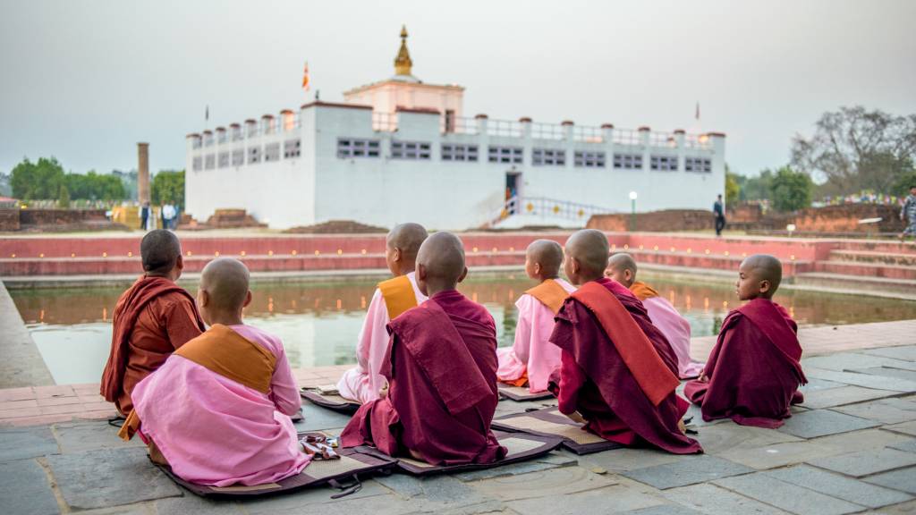 Young Nepalese Buddhist monks worship at the Maya Devi Temple, L Young Nepalese Buddhist monks worship at the Maya Devi Temple, Lumbini, Nepal on March 20, 2019. The site traditionally considered the birthplace of Gautama Buddha and is one of the most important pilgrimage sites for Buddhists from all over the world. (Photo by Oleksandr Rupeta/NurPhoto) (Photo by Oleksandr Rupeta / NurPhoto / NurPhoto via AFP)
