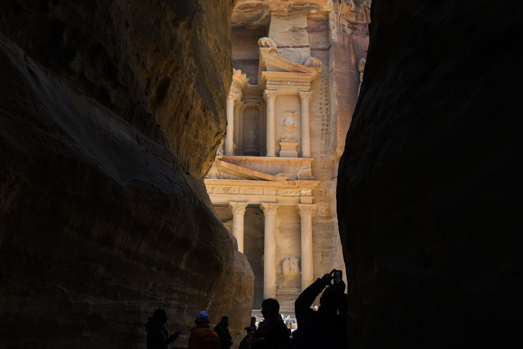 The Treasury, as seen from al-Siq, right before the passage inside the ancient Nabatean city of Petra, that starts from the Dam and ends at Petra's most elaborate ruin, Al Khazneh (the Treasury). On Saturday, February 10, 2019, in Petra, Ma'an Governorate, Jordan. (Photo by Artur Widak/NurPhoto via Getty Images)