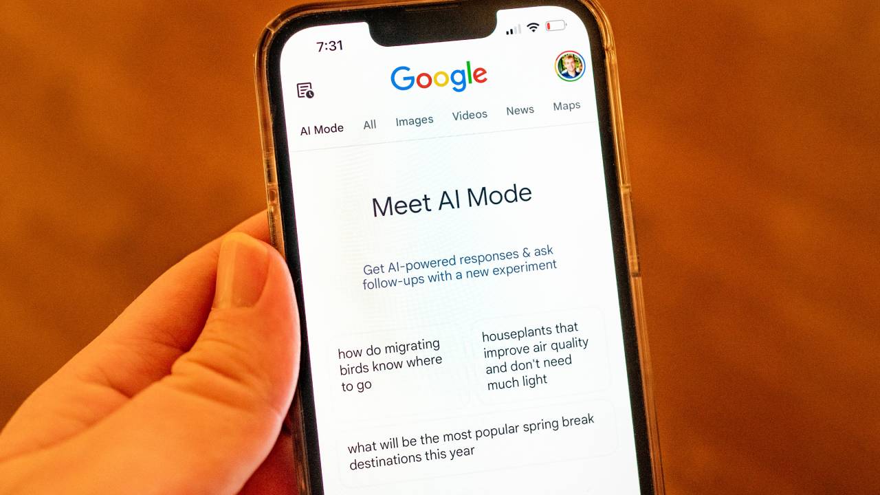 Close-up of a person's hand holding an iPhone and using Google AI Mode, an experimental mode utilizing artificial intelligence and large language models to process Google search queries, Lafayette, California, March 24, 2025.