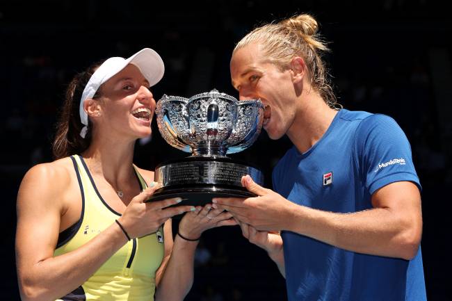 MELBOURNE, AUSTRALIA - JANUARY 27: Luisa Stefani and Rafael Matos of Brazil pose with a trophy after winning in the Mixed Doubles Final against Santa Mirza and Rohan Bopanna of India during day 12 of the 2023 Australian Open at Melbourne Park on January 27, 2023 in Melbourne, Australia. (Photo by Cameron Spencer/Getty Images)