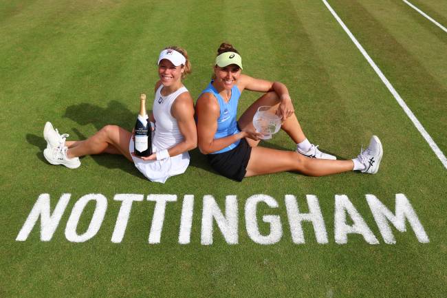 NOTTINGHAM, ENGLAND - JUNE 22: Laura Siegemund of Germany and Beatriz Haddad Maia of Brazil celebrate with their trophies after victory against Ena Shibahara of Japan and Anna Danilina of Kazakhstan during the Women's Doubles Final match on day seven of the Lexus Nottingham Open at the Lexus Nottingham Tennis Centre on June 22, 2025 in Nottingham, England. (Photo by Nathan Stirk/Getty Images for LTA)