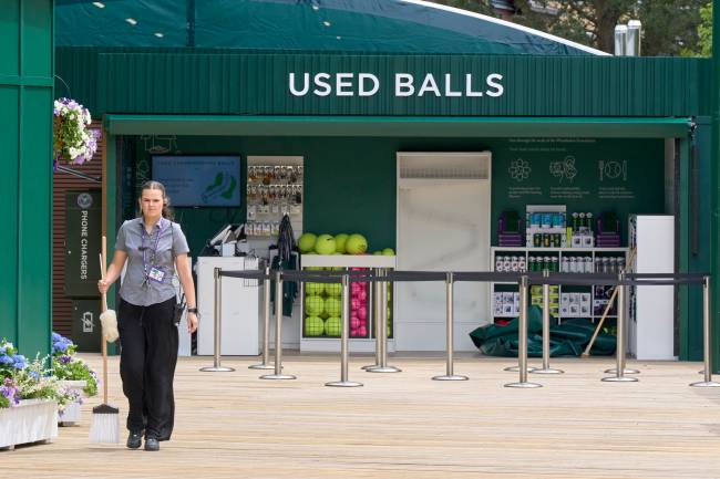 LONDON, ENGLAND - JUNE 26: A cleaning worker walks past the used balls store before The Championships - Wimbledon 2025 at All England Lawn Tennis and Croquet Club on June 26, 2025 in London, England. (Photo by Peter van den Berg/ISI Photos/ISI Photos via Getty Images)