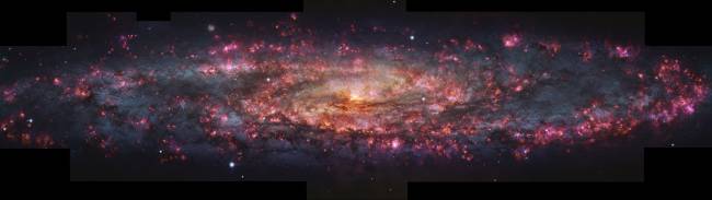 MUSE view of the Sculptor Galaxy This image shows a detailed, thousand-colour image of the Sculptor Galaxy captured with the MUSE instrument at ESO’s Very Large Telescope (VLT). Regions of pink light are spread throughout this whole galactic snapshot, which come from ionised hydrogen in star-forming regions. These areas have been overlaid on a map of already formed stars in Sculptor to create the mix of pinks and blues seen here.