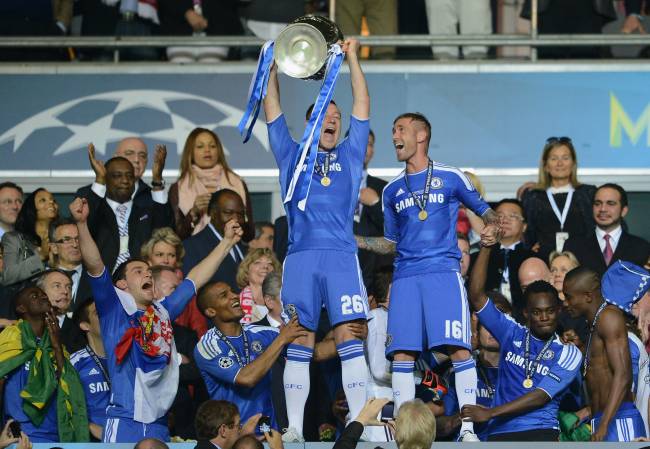 MUNICH, GERMANY - MAY 19: John Terry of Chelsea lifts the trophy in celebration after their victory in the UEFA Champions League Final between FC Bayern Muenchen and Chelsea at the Fussball Arena München on May 19, 2012 in Munich, Germany. (Photo by Darren Walsh/Chelsea FC via Getty Images)