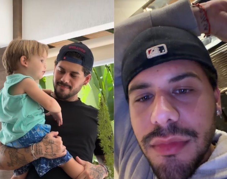 Um homem barbudo com boné preto segura um bebê loiro de camiseta azul e shorts estampados, olhando-o com carinho. À direita, o rosto do homem em close, com boné virado para trás e barba bem cuidada